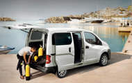 Oxygen bottles being unloaded out of NV200 in harbor