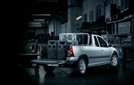Silver Nissan NP200 in warehouse, speakers on its payload